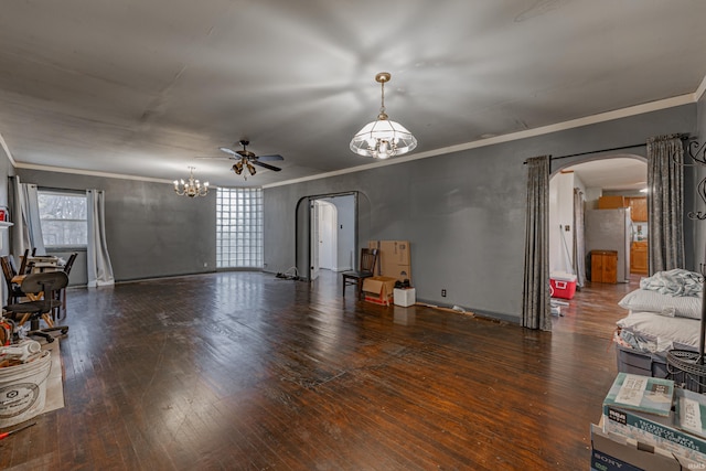 living area with ornamental molding, arched walkways, ceiling fan with notable chandelier, and hardwood / wood-style flooring