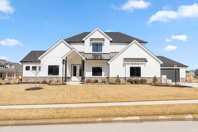 modern farmhouse style home with roof with shingles, french doors, a standing seam roof, and a front yard