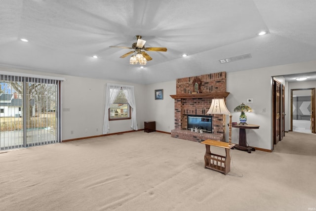 living room with recessed lighting, light colored carpet, visible vents, baseboards, and a brick fireplace