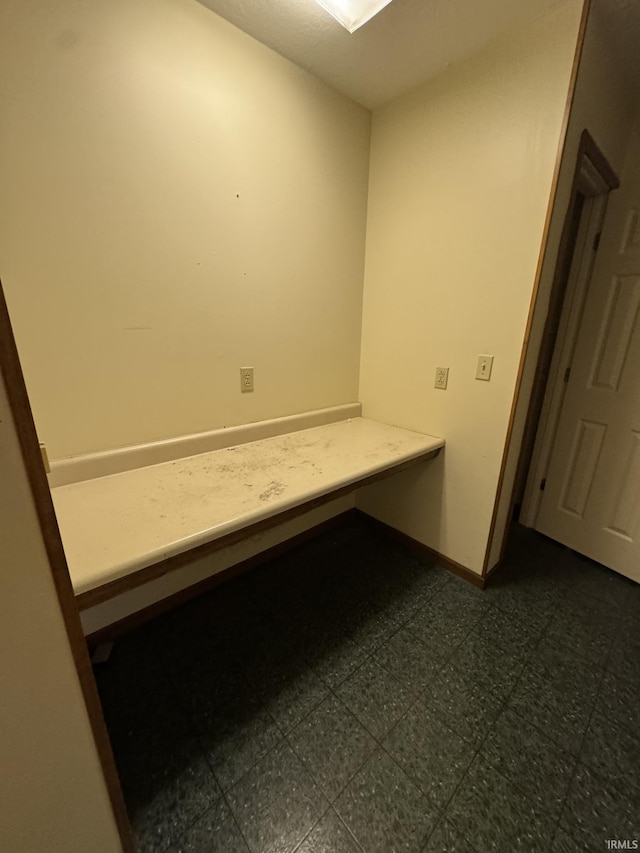 bathroom featuring baseboards and tile patterned floors