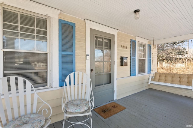 doorway to property featuring covered porch