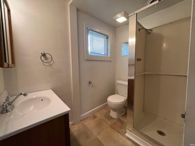 full bath featuring toilet, a stall shower, and vanity