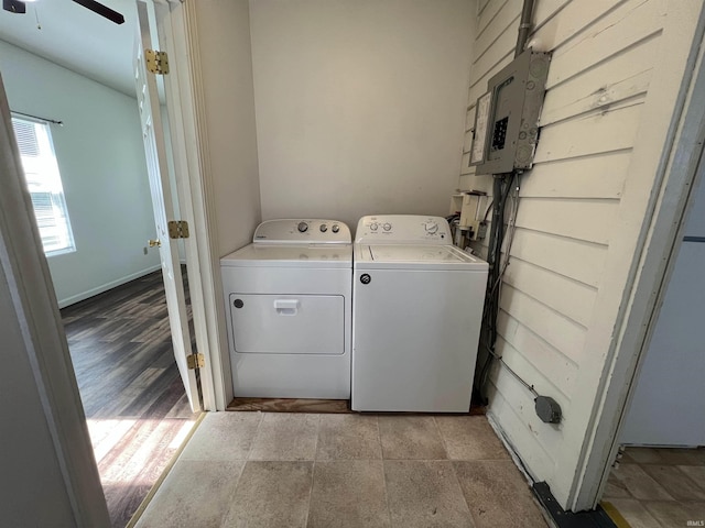 laundry room featuring a ceiling fan, separate washer and dryer, laundry area, electric panel, and baseboards