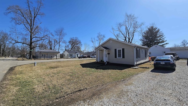 view of home's exterior with a yard