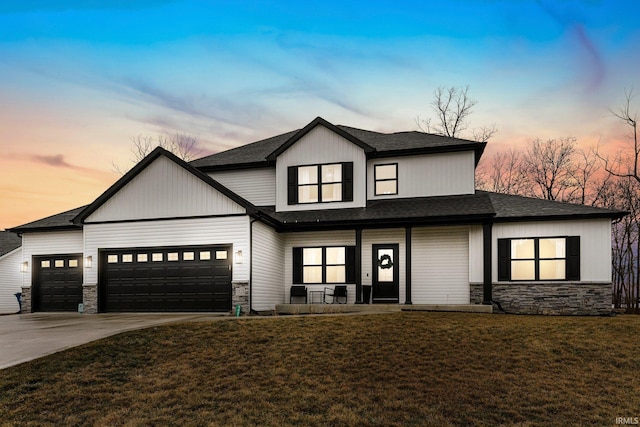 modern farmhouse style home with a garage, concrete driveway, a porch, and stone siding