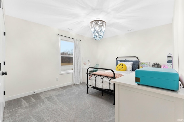 bedroom with light colored carpet, visible vents, and baseboards