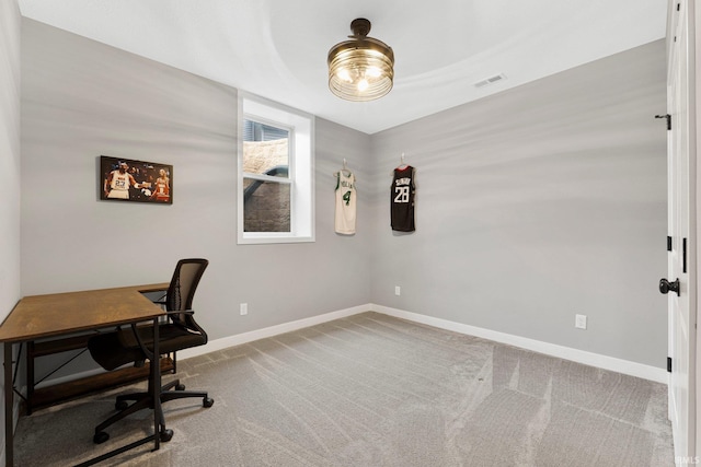 office featuring carpet, visible vents, and baseboards