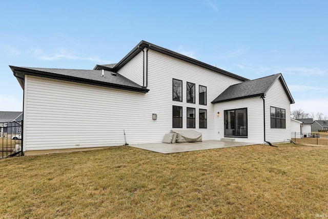 back of house with a patio area, fence, and a yard