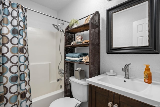 full bath featuring shower / bath combination with curtain, a textured wall, vanity, and toilet