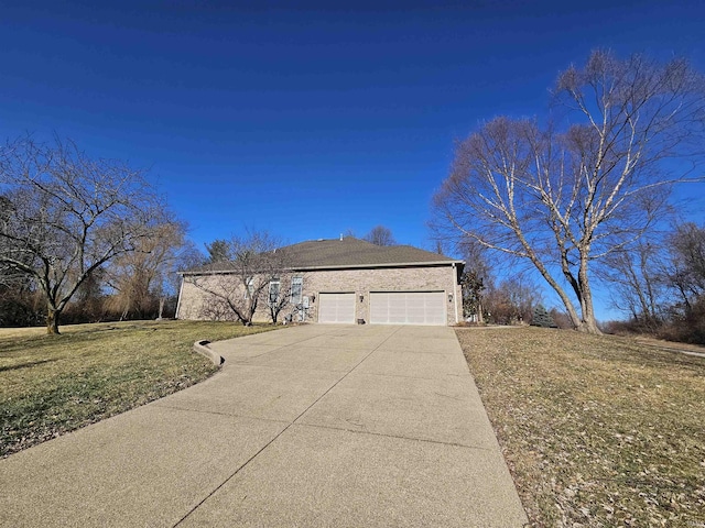 view of home's exterior featuring an attached garage, a lawn, and concrete driveway