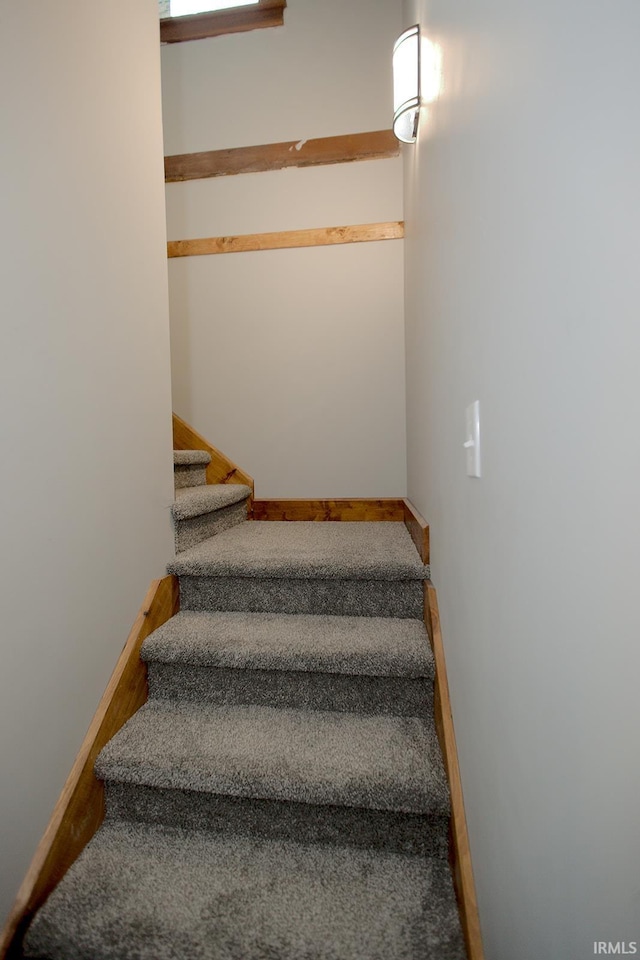 stairway with baseboards