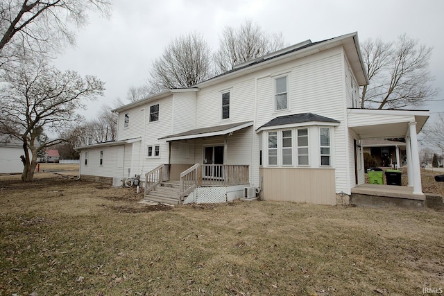 back of house featuring central AC