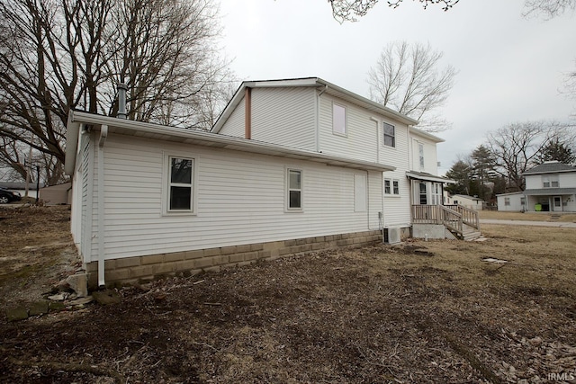 view of property exterior with central AC unit