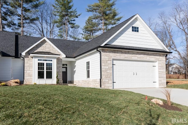 view of front of property with a shingled roof, concrete driveway, stone siding, an attached garage, and a front yard