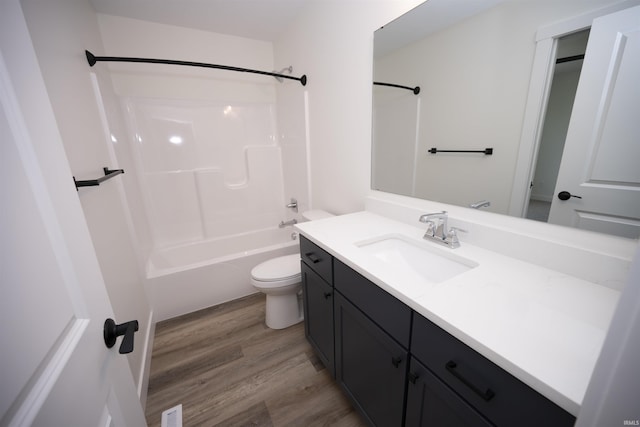 3337 Blarney Dr, South Bend, IN 46628 - full bath featuring wood finished floors, toilet, vanity, and shower / washtub combination