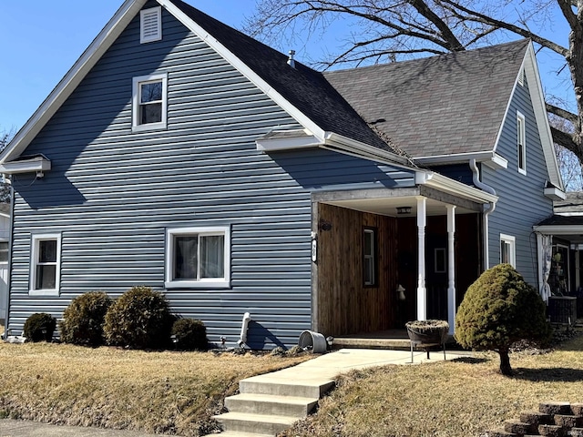 view of front of house with roof with shingles