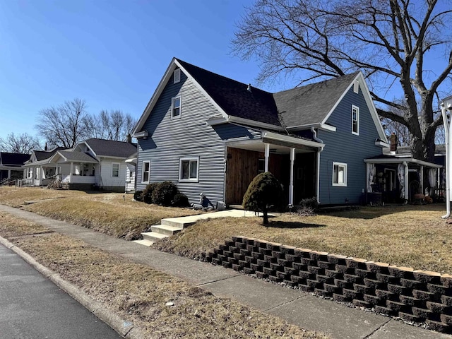 view of property exterior with a lawn