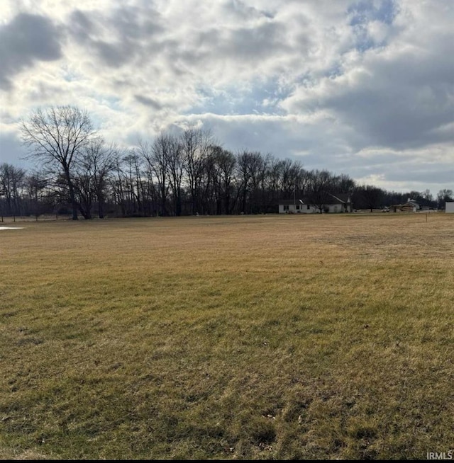 view of yard with a rural view