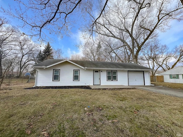 single story home with a garage, fence, driveway, and a front lawn