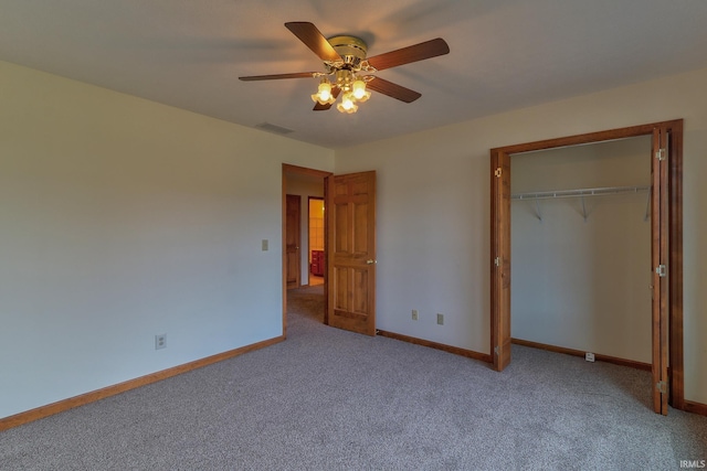 unfurnished bedroom with carpet floors, a ceiling fan, visible vents, baseboards, and a closet