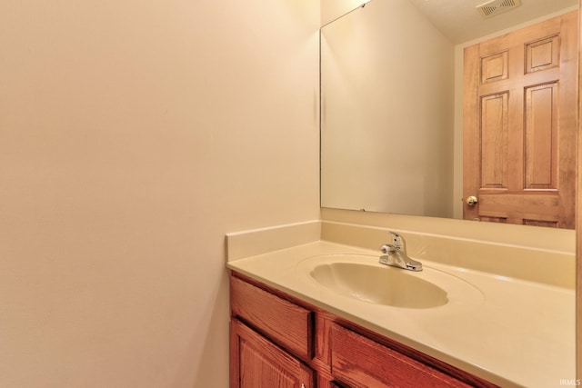 bathroom featuring visible vents and vanity