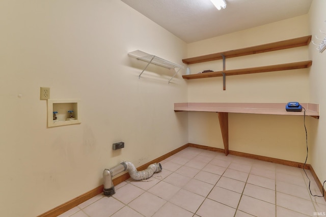 laundry room featuring laundry area, washer hookup, light tile patterned flooring, and baseboards