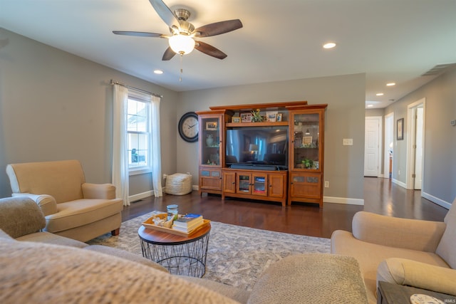 living area with baseboards, wood finished floors, a ceiling fan, and recessed lighting