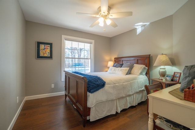 bedroom with ceiling fan, baseboards, and dark wood-style flooring