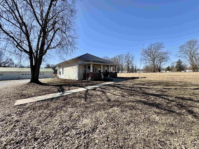 view of property exterior featuring a porch