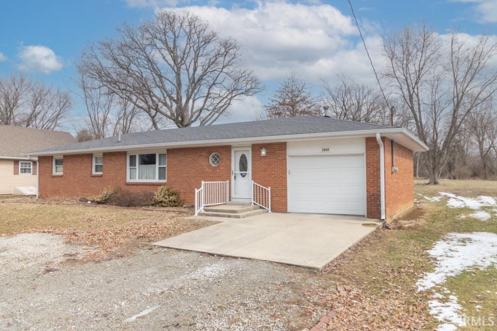 2600 S Main St, New Castle, IN 47362 - ranch-style house with a garage, brick siding, and driveway