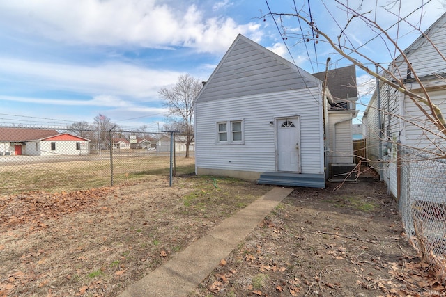 back of house with fence