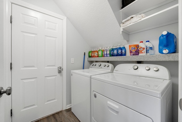 laundry area with laundry area, separate washer and dryer, and dark wood finished floors