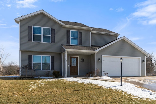 view of front of home featuring a garage, concrete driveway, and a front lawn