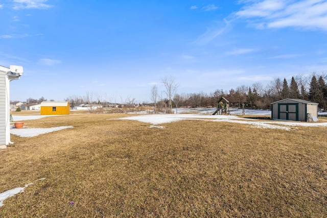 view of yard with an outbuilding and a storage shed