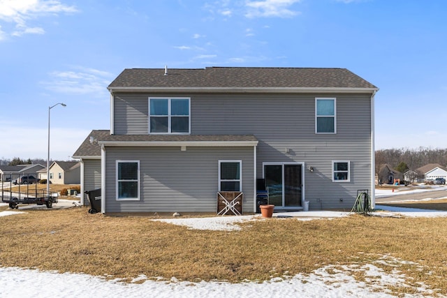 rear view of property featuring a patio area and a yard