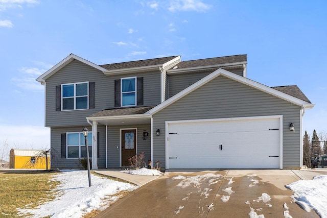 view of front of home featuring a shingled roof and an attached garage