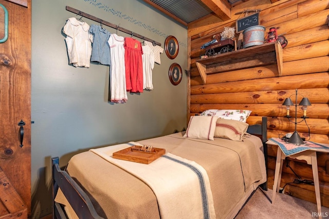 bedroom featuring carpet floors and log walls