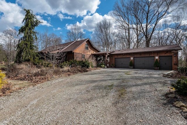 view of home's exterior featuring driveway and an attached garage