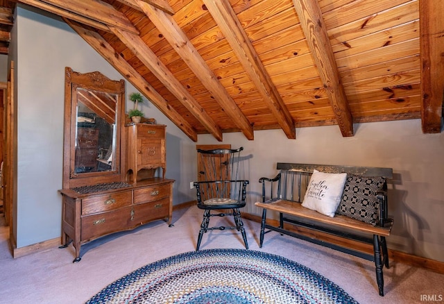 living area with lofted ceiling with beams, wooden ceiling, light carpet, and baseboards