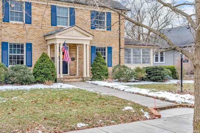 view of front of house with brick siding