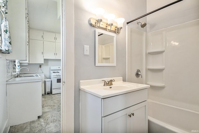 full bathroom featuring shower / bathtub combination and vanity