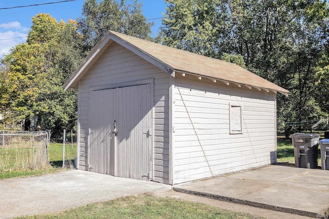 view of shed with fence