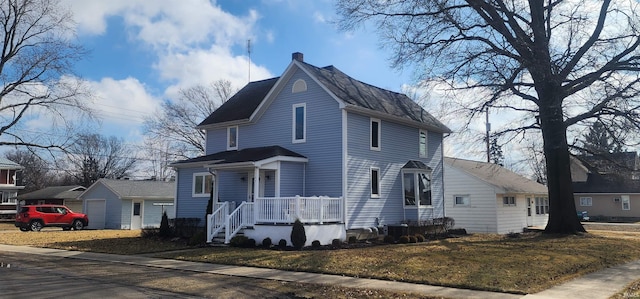 view of front of property with a garage and a front lawn