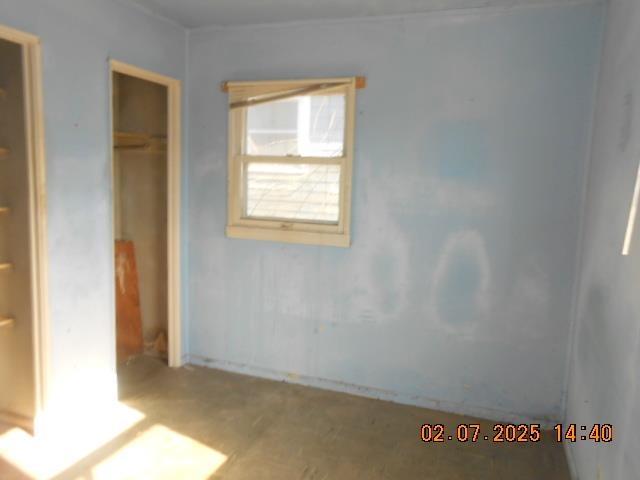 unfurnished bedroom featuring a closet