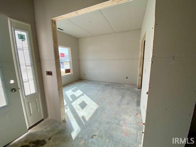 entrance foyer with concrete flooring