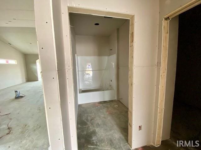 bathroom featuring unfinished concrete flooring