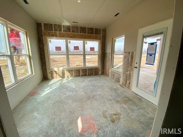 unfurnished sunroom with a wealth of natural light