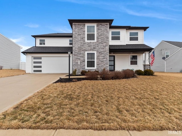 view of front facade with stone siding, a front lawn, an attached garage, and driveway