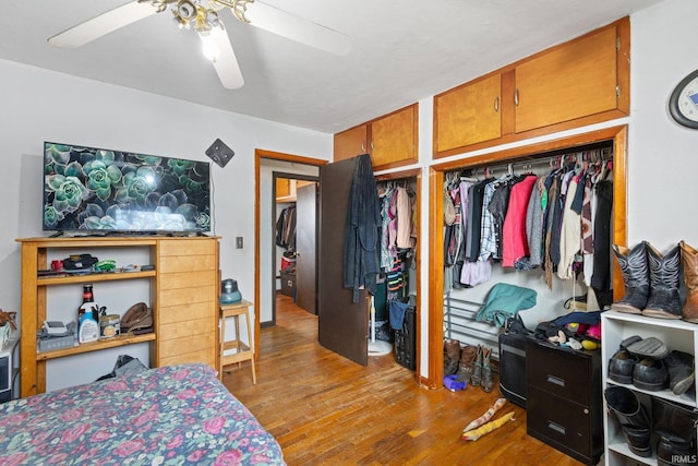 bedroom featuring a ceiling fan and wood finished floors