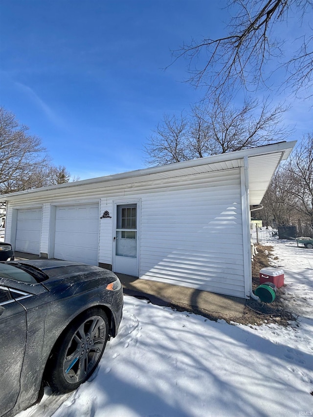 view of snow covered garage